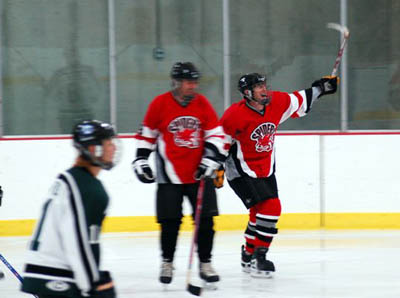 Mark Franklin (7) cellys his first goal along with Dave Schaefer (9), in the first period.