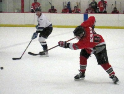 Eric Schlais (88), fires the puck in.