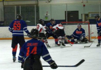 Shawn Tromiczak (36) and Brad Butalla (12) crash the Shame net.