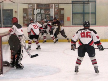 Tim Stalpes (96) covers the slot while Chris Stalpes (21) and Doug Thorson play the corner.