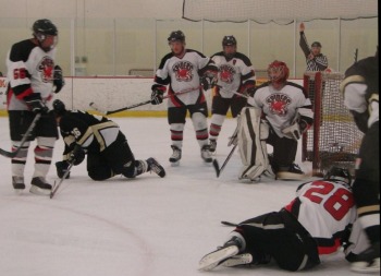 Tim Forcelle (28) demonstrates his napping skills to the rest of the Spider backchecking crew.