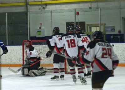 Spiders backcheckers wait in line to congratulate Dow on his upcoming save.