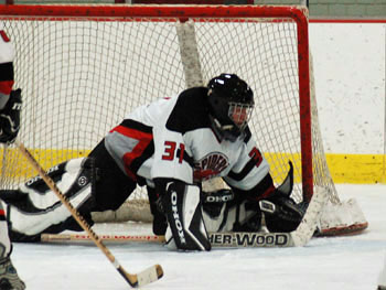 Goalie Jeff Keacher stops another one. Photo: Julie Berris