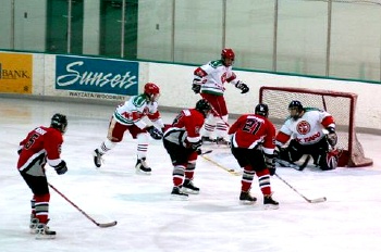 Schliesman (24) and Samsel (21) shoot on goal.