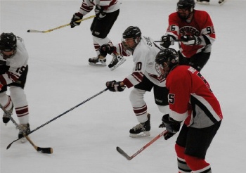 Defenseman Mike Montgomery (96) allowing the Outlaws forward to get a closer look his new Montreal stick blade.