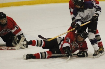 Defenseman Marc Berris gets a better view of the puck.