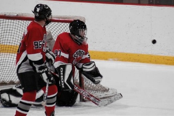 Goalkeeper Jeff Keacher and defenseman Mike Montgomery watch one that missed wide.