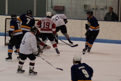 New Spider Brian Armagost (77) works in Gretsky’s Office, while John Macdonald (19) and former Spider Steve Tangen (6) cover the slot, in the Oct. 13 game vs. the Fighting Saints.