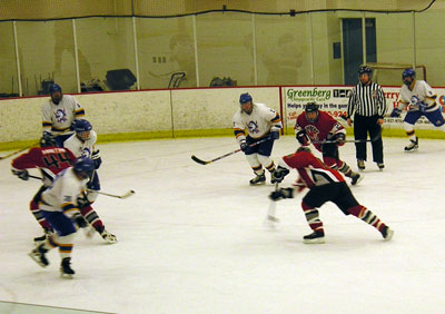 Jim Maietta unloads on the Buccaneers, as Lee Martini (44) and Dave Schliesman (24) look on.