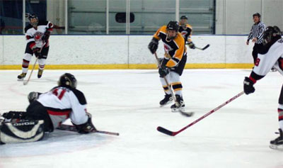 Goalkeeper Jeff Keacher (31) flops to stop a Chickens’ shot. 