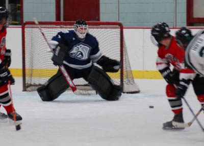Sub Goalie Extraordinaire Chris Trinh seeing the puck clearly.
