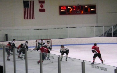 Carlos Eberhardt (11) gets the drawback from Mike Johnson and shoots on net with 38 seconds remaining, in what would be the Spiders’ only good scoring chance at the end of the game.