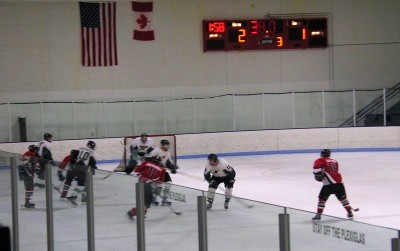 Carlos Eberhardt (11) gets the drawback from Mike Johnson and shoots on net with 38 seconds remaining, in what would be the Spiders’ only good scoring chance at the end of the game. 