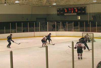 Defenseman Jeremy Litton (14) and center Bruce Gustafson (10) give sub goalie Pat Ridgley some two-on-none reps.