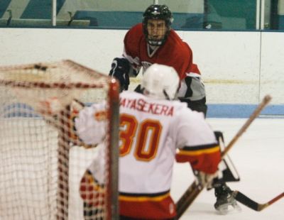 Jay Hilden (7) roofs it past Jayasekera.