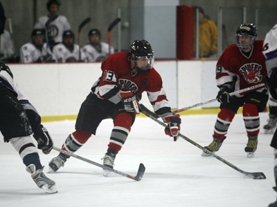 Aaron Bedessem (13) opens a shooting lane, supported by Eric Ackermann (99).