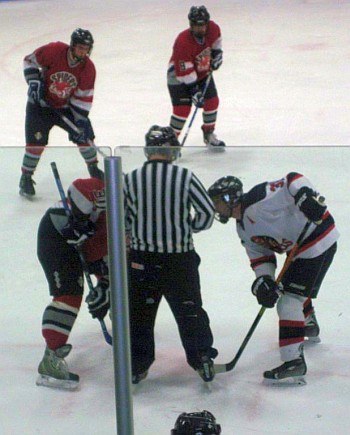 Chris Pettengill (30) awaits the puck drop.