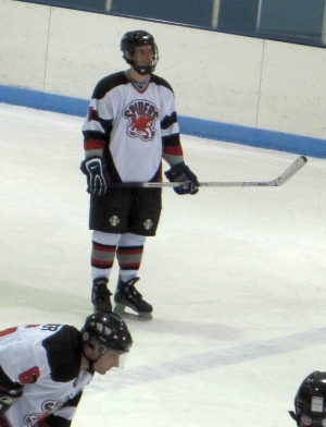 Jay Hilden (7) looks for the video feed replay on the New Hope scoreboard.