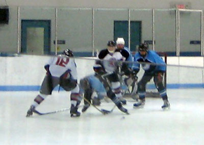 Flannery (12) and Johnson (42) in the goalmouth scrum prior to the Spiders’ second tally.