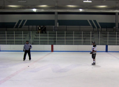 The New Hope crowd on its feet as Baker (6) prepares for his penalty shot (attempt).