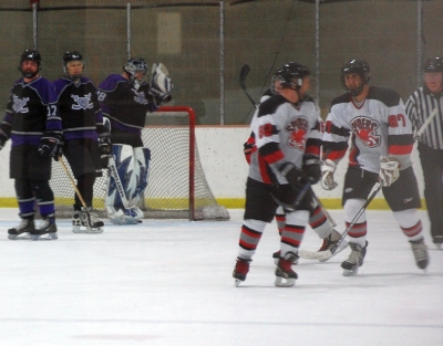 The Semper Fi line celebrates their second-period goal, much to the chagrin of the Royals D.