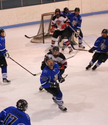 The Hounds’ Danielson checks the scoreboard video replay.